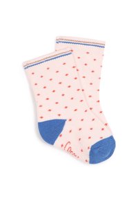 Chaussettes rose clair avec de petits pois rouges, accents bleus au niveau des orteils, et bords rayés en bleu, marron et blanc. Texture tricotée.