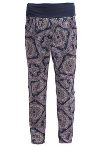 Patterned pants with a navy waistband, featuring a purple, cream, and navy floral and geometric design. Elastic material, slim fit.