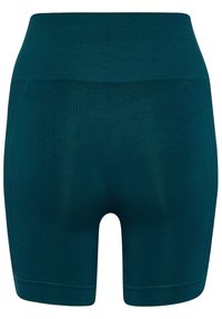 Tealfärgade shorts med smal passform och bred elastisk midja, tillverkade av stretchigt material, med subtila texturerade detaljer och med längd till mitten av låret.