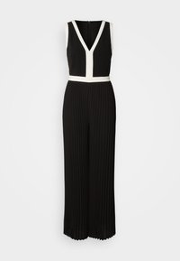 Jumpsuit plissé noir avec un décolleté en V et des accents blancs à la taille et au corsage. Présente une fermeture éclair au dos. Texture de tissu lisse.