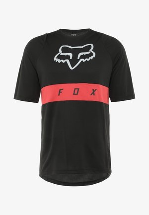 Mustat lyhythihaiset urheilupaidat, joissa on verkkomainen rakenne, joissa on harmaa kettu -logo ja punainen vaakasuora raita, jossa on musta painatus "FOX".