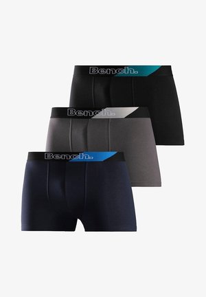 Drei Paare Männerboxershorts in einem Schwarz-, Grau- und Marinefarbenschema. Jede hat einen elastischen Bund mit dem "Bench."-Logo und Akzenten.