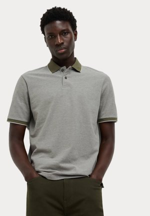 Grey polo shirt with a dark green collar and cuffs. Features three-button placket and contrast stitching. Fabric appears soft and textured.