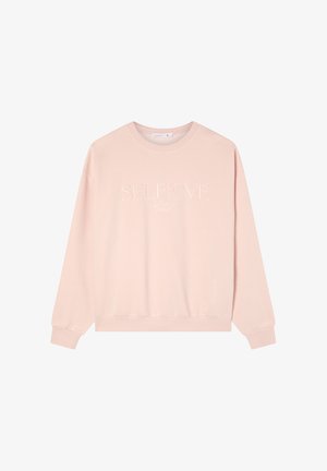 Felpa rosa con maniche lunghe, collo rotondo, polsini e orlo inferiore a coste. Presenta il testo "SELFLOVE Club" in rilievo di una tonalità leggermente più scura.