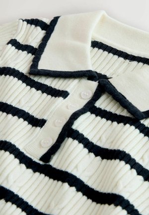 Knitted polo shirt featuring a cream base with thick black horizontal stripes. It has a ribbed texture, a fold-down collar, and five buttons.