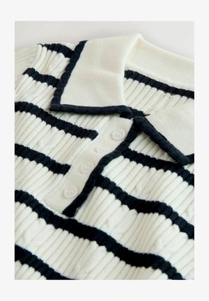 Knitted polo shirt featuring a cream base with thick black horizontal stripes. It has a ribbed texture, a fold-down collar, and five buttons.