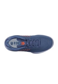 Blue athletic shoe with textured material, featuring orange accents and a mesh design. The lace closure and rubber sole provide stability.