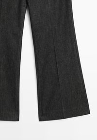 Dark gray wide-leg trousers made from textured fabric, featuring a smooth waistband and neatly finished hems. No visible patterns or hardware.