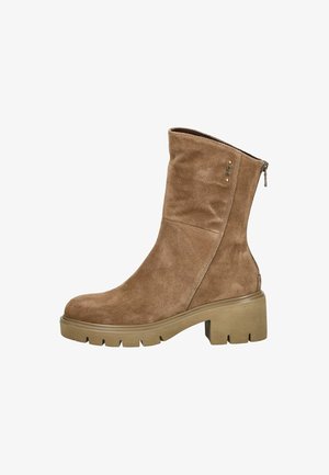 Brown suede ankle boot with a rounded toe and side zipper. Chunky beige sole with treaded bottom for grip. Clean, simple design.