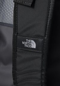 The North Face BASE CAMP DUFFEL S UNISEX - Holdall - indigo plum/bright foam papaya