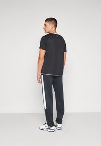 Fila PANTS JAN - Jogginghose - black/white