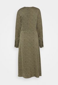 Robe midi à manches longues avec petit imprimé floral jaune sur fond vert foncé, taille ajustée et encolure ronde, vue de dos.