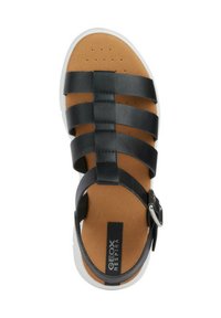 Sandalo in pelle nera con più cinghie e una fibbia, dotato di una soletta imbottita color beige e una suola bianca con piccole perforazioni.