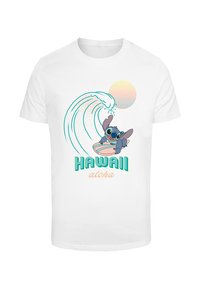 Valkoinen puuvillapaita, jossa on sarjakuvahahmo surffaamassa aallolla, ja jossa on tekstit "HAWAII" ja "aloha" teal- ja persikan värissä.