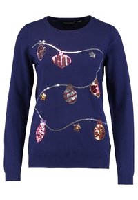Jersey de color navy con adornos navideños cosidos con lentejuelas a lo largo de un hilo plateado. Cuello redondo y mangas largas. Material de punto suave.