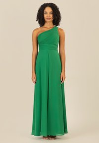 Einseitiges grünes Kleid mit plissiertem Oberteil und fließendem Rock, aus leichtem Material gefertigt. Bodenvollendes Design mit sanftem Glanz.