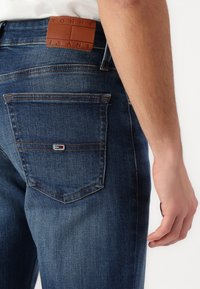 Tommy Jeans RYAN  - Straight leg jeans - denim dark