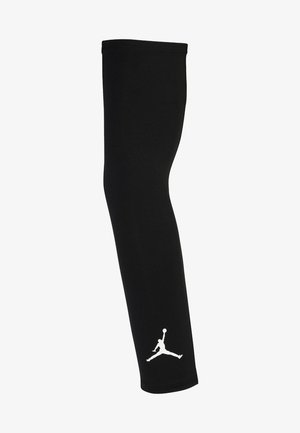 Manga atlética negra hecha de una tela suave, con un logo Jumpman blanco cerca de la parte inferior, con un diseño ajustado y alargado.