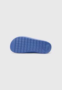 Blue rubber shoe sole with a textured grid pattern and a rounded toe. Features a logo imprint near the heel. Clean and uniform design.