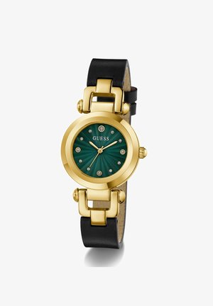 Reloj redondo dorado con esfera texturizada verde, marcadores de hora de cristal, correa de cuero negra y logotipo de Guess en la posición de las 12 en punto.