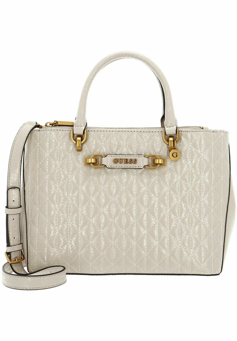 Sac à main beige matelassé avec quincaillerie dorée, double anses supérieures, bandoulière ajustable et plaque de logo. Comprend une fermeture à glissière et une finition texturée.