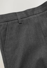 Gray tailored trousers made from textured fabric, featuring a flat front, belt loops, and front pockets without visible hardware.