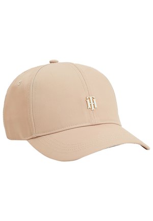 Lysebeige baseballkasket med en buet skygge og et sammenflettet "TH" guldfarvet metal-logo på det forreste midterpanel.