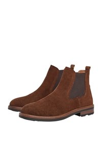 Botas Chelsea de ante marrón con paneles laterales elásticos, lengüetas de tirón y una suela de goma texturizada. El diseño presenta una punta redonda y costuras mínimas.