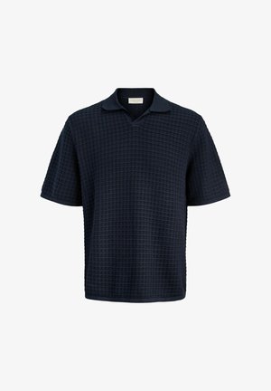 Lühikeste varrukatega tumelilla tekstuuriga kootud polo-särk, pehme kraega ja lõdva lõikega.