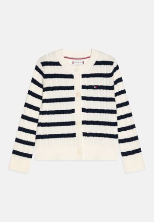 Hvid kabelstrikket cardigan med sorte vandrette striber, lange ærmer, knaplukning og lille Tommy Hilfiger-logo på venstre bryst.
