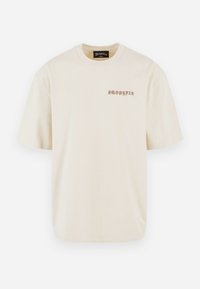 T-shirt à manches courtes couleur crème avec le texte « Dropsize » en police stylisée sur la partie supérieure gauche de la poitrine et un col rond.