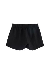 Pantaloni neri con vida elasticizzata, realizzati in tessuto morbido. Il design presenta un taglio semplice e pulito con una forma leggermente svasata.