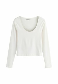Hvid langærmet top med rund hals, lavet af blødt bomuldsstof. Funktioner et cropped design og en ensfarvet finish uden mønstre.