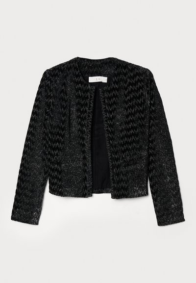 Black cropped jacket with a textured, zigzag pattern, featuring metallic threads for shimmer. No fastenings, round neckline, and long sleeves.