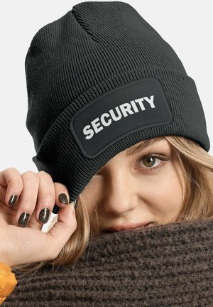 Black beanie made of ribbed knit material featuring a prominent patch that says "SECURITY" in white text. Soft texture and snug fit.