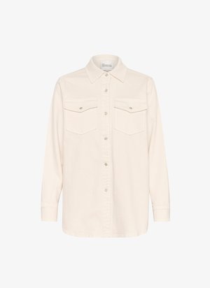 Světle krémová košile na knoflíky, dlouhé rukávy, dvě kapsy na hrudi s klopou, měkká látka, klasický límec a rovný lem.