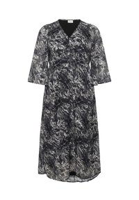 Robe à motifs noir et blanc avec un décolleté en V, des manches trois-quarts et une taille élastique, fabriquée dans un tissu léger et fluide.