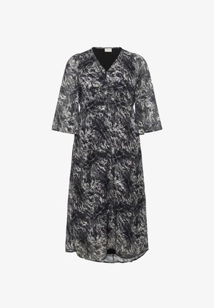 Black and white patterned dress with a V-neckline, three-quarter sleeves, and an elastic waist, made from a lightweight, flowy fabric.
