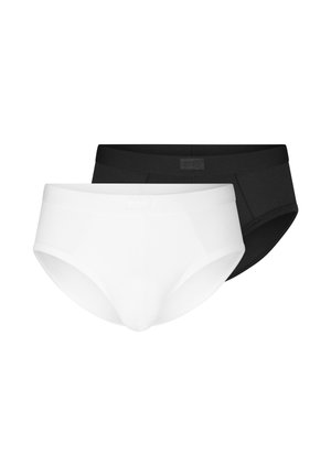 Zwei Herren-Slips in Schwarz und Weiß, flach liegend mit dem weißen Paar vorne und dem schwarzen Paar hinten.