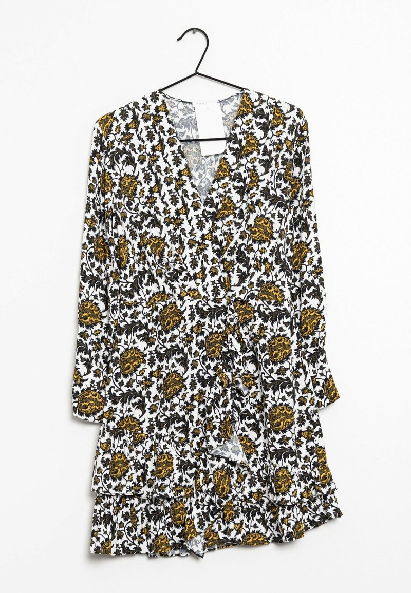 Robe blanche à manches longues avec motif floral noir et jaune, ourlet froncé et col en V, suspendue sur un cintre noir sur fond blanc.