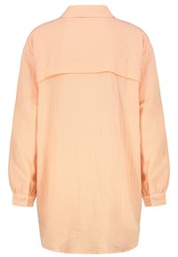 Pfirsichfarbens Langarmhemd aus strukturiertem, zerknittertem Stoff, mit Knopfmanschetten und einem Rückeneinsatz-Design.