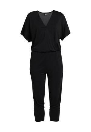 Combinaison noire à manches courtes avec col en V, taille élastique et pantalon fuselé longueur cheville.