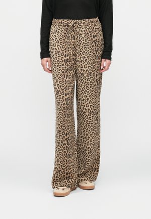 Pantalons larges à motif léopard en tissu doux, dotés d'une taille élastique et d'un cordon de serrage. Les tons de couleur incluent le beige et le noir.