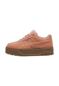 Pink suede low-top sneakers with a thick rubber sole, featuring decorative stitching and a logo on the side. Smooth texture throughout.