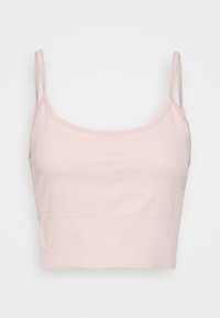 Top cropped canelado rosa claro com finas alças de espaguete e um design sem costuras. Feito de um tecido macio, apresenta uma silhueta ajustada.