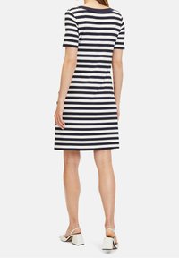 Short-sleeve dress with navy and white horizontal stripes, made of stretch fabric, features a relaxed fit and knee-length design.
