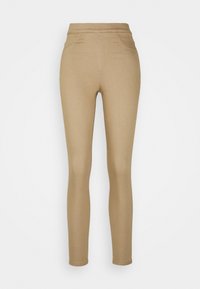 Beige leggings med en slät textur, hög midja, smal passform och minimal sömdetalj. Lämpliga för vardagsanvändning och lagerpåsättning.