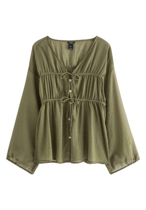 Olivengrøn bluse med V-hals, indsnævret talje, knaplukning og lange ærmer. Fremstillet af let, tekstureret stof.