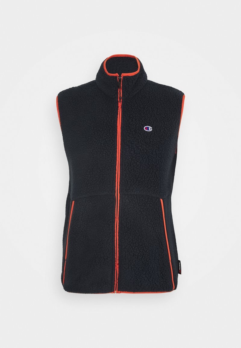 Gilet sans manches en polaire noire avec passepoil orange, fermeture éclair à l'avant, deux poches et un petit logo Champion sur la poitrine.