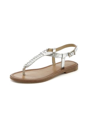 Silver metallic thong sandal with braided strap design, flat sole, adjustable ankle strap, and smooth brown insole.